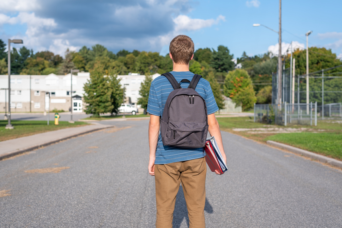 Teenager walking to school.